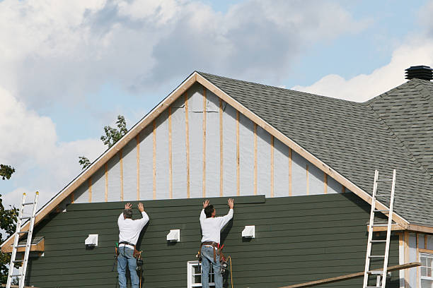 Professional Emergency Siding Repair technician working in Baldwin, NY